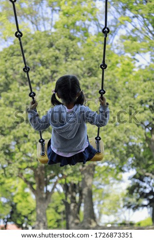 Similar – old swing on the playground on the street