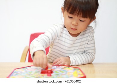 Japanese Girl Playing With Boardgame (3 Years Old)