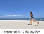 Japanese girl running in the beach in Pandanon Island in the Philippines Cebu