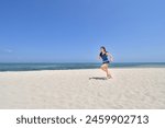 Japanese girl running in the beach in Pandanon Island in the Philippines Cebu