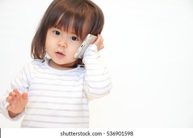 Japanese Girl Using A Smart Phone (2 Years Old)