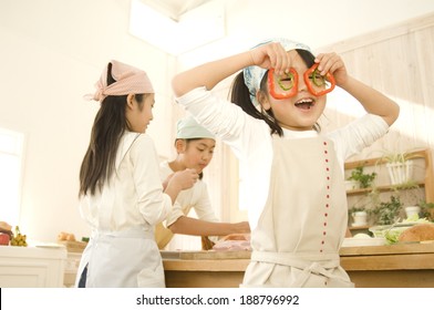 Japanese girls cooking in kitchen