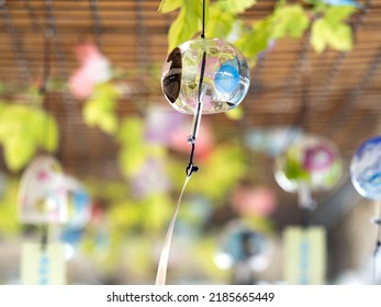 Japanese Glass Wind Chime Swaying In The Wind