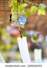 Japanese Glass Wind Chime Swaying In The Wind