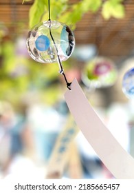 Japanese Glass Wind Chime Swaying In The Wind