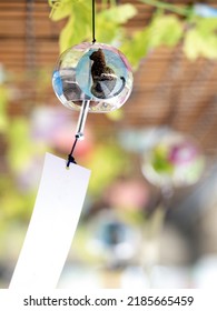 Japanese Glass Wind Chime Swaying In The Wind