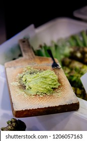 Japanese Grated Fresh Green Nagano Wasabi On Traditional Shark Skin Wooden Grater. Close Up Shot