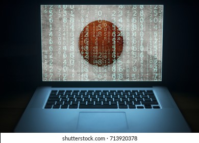 Japanese hacker. Laptop with binary computer code and Japan flag on the screen. Internet and network security.