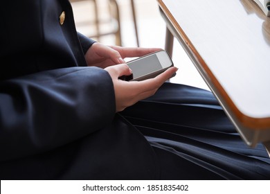 A Japanese Junior High School Girl Hiding In The Classroom To Operate Her Phone