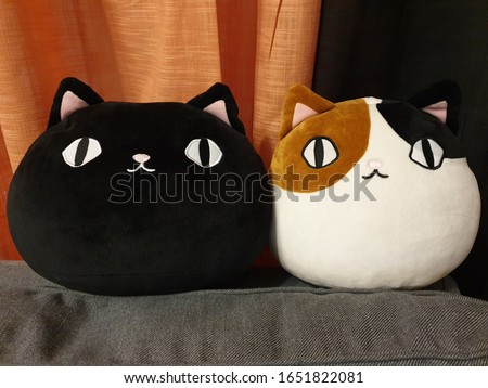 Japanese kawaii style plush toy cats. Cute soft cushions in shape of a kitten's round face.