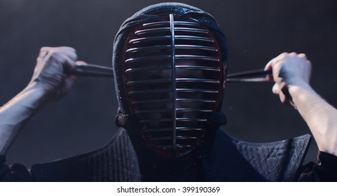 Japanese Kendo. Kendo Fighter Wears A Helmet.