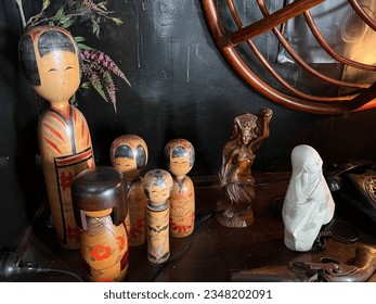 Japanese Kokeshi dolls placed in a room.
