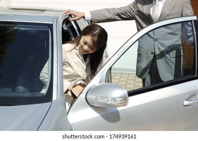 Japanese Lady Getting Into A Car