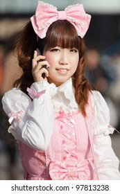 Japanese Lolita Cosplay Woman Phoning, Tokyo