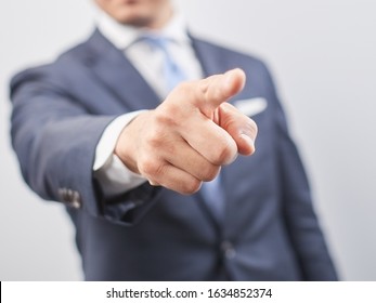 Japanese male businessman pointing out