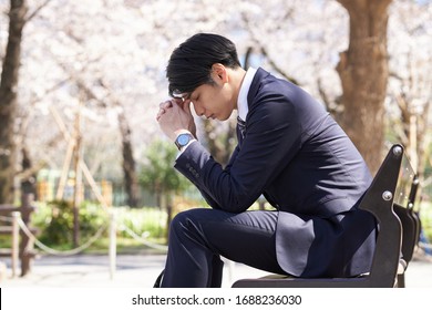 Japanese Male Businessmen Who Are Troubled By Worries