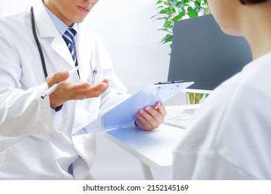 Japanese male doctors and female patients - Shutterstock ID 2152145169