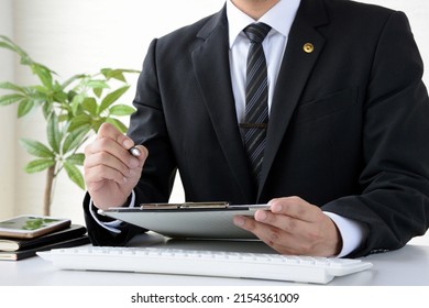 Japanese male lawyer counseling in office - Shutterstock ID 2154361009