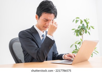 Japanese Man Complaining Of Fatigue