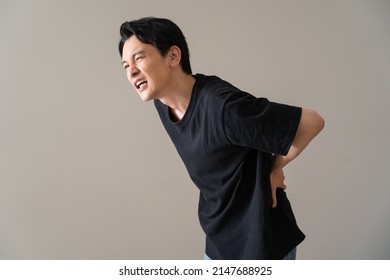 Japanese Man Complaining Of Lower Back Pain