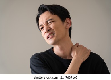 Japanese Man Complaining Of Neck Pain