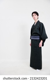 Japanese Man In Kimono And White Background