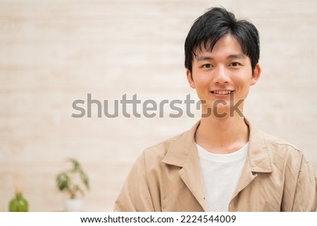 Japanese man looking at camera