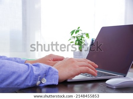 A Japanese man operating a computer
