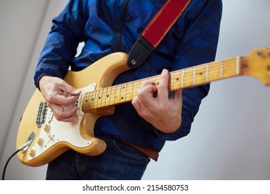 Japanese Man Playing Electric Guitar