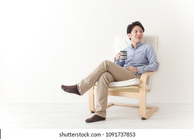 Japanese man relax in the chair - Shutterstock ID 1091737853