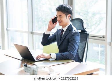 Japanese man in a suit - Powered by Shutterstock