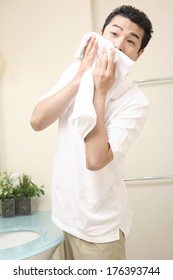 Japanese Man Wiping The Face