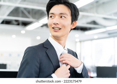 Japanese man in a young suit - Shutterstock ID 2223175479