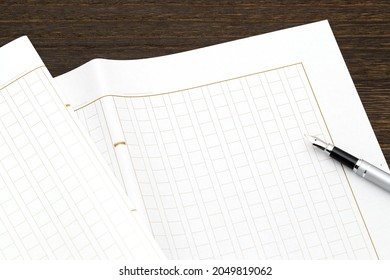 Japanese manuscript paper with fountain pen, Genko yoshi on wooden table   - Powered by Shutterstock