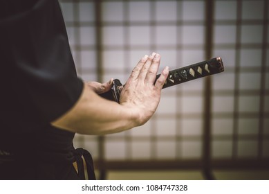 Japanese Martial Arts Athlete Training Kendo In A Dojo - Samaurai Practicing In A Gym