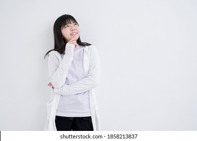 Japanese Middle School Girls Thinking Of Ideas On A White Background