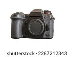 Japanese mirrorless digital camera in Micro Four Thirds format. Front view. Black background