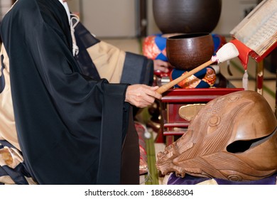 Japanese Monk Praying At A Temple