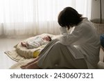A Japanese mother and her newborn baby tired of their baby