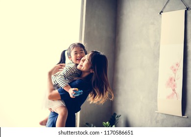 Japanese Mother Playing With Her Daughter