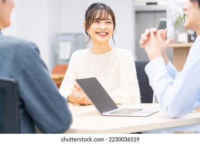 Japanese people wearing office casual clothes for a meeting - Shutterstock ID 2230036519