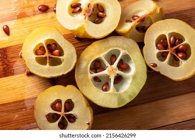Japanese quince fruit, Chaenomeles Lindl. Close-up of ripe, sliced Japanese quince fruit with small brown seeds. Fruit with vitamins for preserves.
