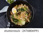 Japanese Ramen with chicken, Mushrooms, Eggs and bok choy cabbage in a bowl 
