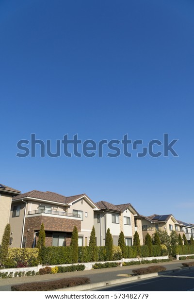 \
Japanese residential residential area image blue\
sky looking up at\
sun
