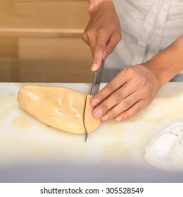 Japanese Restaurant Chef Cutting Foie Gras For Making Sushi