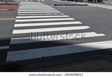 Similar – Road crossing with wide crosswalk in the USA