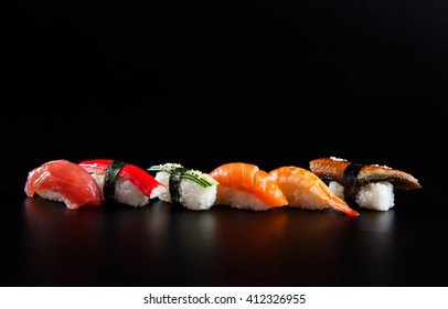 Japanese seafood sushi, on black background 