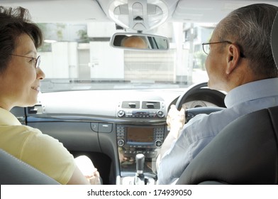 Japanese Senior Driving A Car