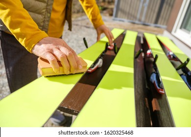 Japanese Senior Woman Waxing Skis