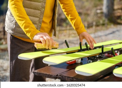 Japanese Senior Woman Waxing Skis